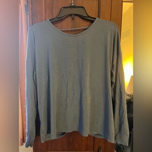 Elan medium blue long sleeve shirt with cute knot in back